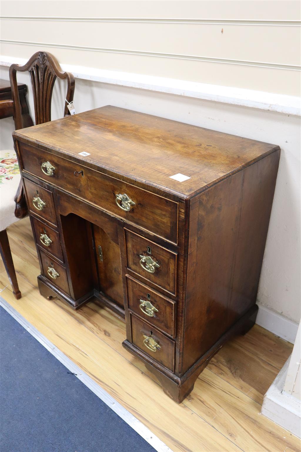 A mid 18th century walnut kneehole desk, width 76cm, depth 43cm, height 73cm